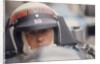 Jackie Stewart at the wheel of a racing car by Unknown