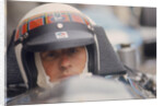 Jackie Stewart at the wheel of a racing car by Unknown
