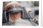Jackie Stewart at the wheel of a racing car by Unknown