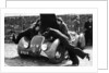 Miss MD Patten looking at the engine of a 1938 Peugeot 402 Special Sport, RAC Rally, 1939 by Unknown