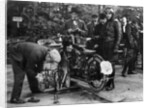 Karl Burlage having his Norton bike weighed for a TT competition by Unknown