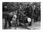 Karl Burlage having his Norton bike weighed for a TT competition by Unknown