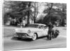 An Oldsmobile at the corner of an American street, 1954 by Unknown