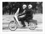 A man and a woman riding an Ariel Leader, 1958 by Unknown
