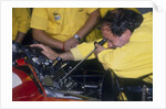 Mechanic at work in the Ferrari pits, 1988 by Unknown