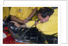 Mechanic at work in the Ferrari pits, 1988 by Unknown