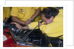 Mechanic at work in the Ferrari pits, 1988 by Unknown