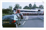 Traffic queue at level crossing in Brockenhurst, Hampshire by Unknown