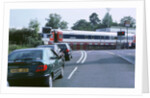 Traffic queue at level crossing in Brockenhurst, Hampshire by Unknown