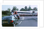 Traffic queue at level crossing in Brockenhurst, Hampshire by Unknown