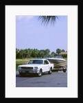 1967 Ford Mustang towing a boat by Unknown