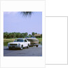1967 Ford Mustang towing a boat by Unknown