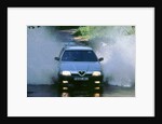 1989 Alfa Romeo 164 driving through a ford by Unknown