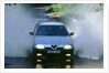 1989 Alfa Romeo 164 driving through a ford by Unknown