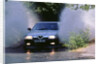 1989 Alfa Romeo 164 driving through a ford by Unknown