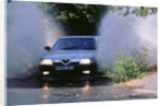 1989 Alfa Romeo 164 driving through a ford by Unknown
