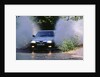 1989 Alfa Romeo 164 driving through a ford by Unknown