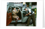 Mechanic with lady driver doing her make up, 1930's Hillman Minx by Unknown