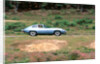 1965 Jaguar E type with smiling driver by Unknown