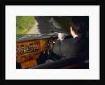 Chauffeur driving 1970 Daimler vanden plas DS 420 limousine by Unknown