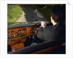Chauffeur driving 1970 Daimler vanden plas DS 420 limousine by Unknown