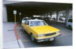 Yellow taxi cab at airport by Unknown