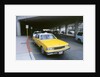 Yellow taxi cab at airport by Unknown