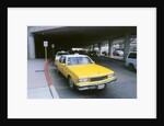 Yellow taxi cab at airport by Unknown
