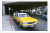Yellow taxi cab at airport by Unknown