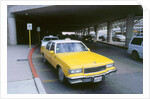 Yellow taxi cab at airport by Unknown