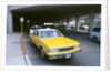 Yellow taxi cab at airport by Unknown