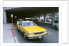 Yellow taxi cab at airport by Unknown