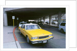 Yellow taxi cab at airport by Unknown