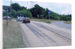 Tyre skidmarks on road surface by Unknown