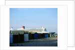 Queen Mary II sails past Beach Huts, Calshot May 2004 by Unknown