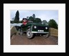 Child driving a toy Land Rover by Unknown