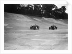Austin Ulster leading a Windsor on the banking at Brooklands by Bill Brunell