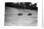 Austin Ulster leading a Windsor on the banking at Brooklands by Bill Brunell