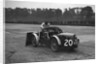 Mechanic making adjustments to a MG C type, Brooklands by Bill Brunell
