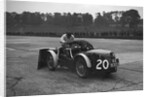Mechanic making adjustments to a MG C type, Brooklands by Bill Brunell