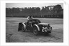 Mechanic making adjustments to a MG C type, Brooklands by Bill Brunell