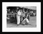 Mechanic working on a Talbot 105 at the JCC Double Twelve race, Brooklands, 8/9 May 1931 by Bill Brunell