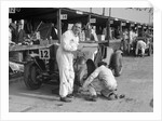 Mechanic working on a Talbot 105 at the JCC Double Twelve race, Brooklands, 8/9 May 1931 by Bill Brunell