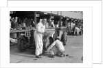 Mechanic working on a Talbot 105 at the JCC Double Twelve race, Brooklands, 8/9 May 1931 by Bill Brunell