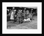 Mechanic working on a Lea Francis J type at the JCC Double Twelve race, Brooklands, May 1931 by Bill Brunell