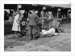 Mechanic working on a Lea Francis J type at the JCC Double Twelve race, Brooklands, May 1931 by Bill Brunell