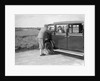 Hugh McConnell, Sammy Davis and Mrs Davis with an Austin 20/6 landaulette at Brooklands, 1931 by Bill Brunell