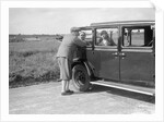 Hugh McConnell, Sammy Davis and Mrs Davis with an Austin 20/6 landaulette at Brooklands, 1931 by Bill Brunell