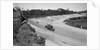 Eddie Hall's Bentley leading a Bugatti on the banking at Brooklands. by Bill Brunell