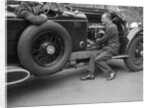 Geoffrey Baker inspecting the engine of a Minerva car by Bill Brunell